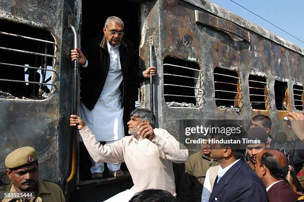 Bhupinder Hooda chief minister of Haryana visiting the site of Delhi Atari train fire at Diwana in Panipat. The 2007 Samjhauta Express bombing was a...