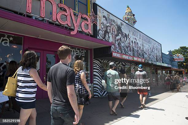 Pedestrians walk down South Congress Avenue in Austin, Texas, U.S., on Saturday, July 23, 2016. Consumer confidence was little changed in July as...