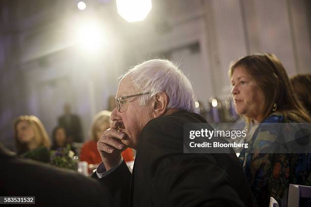 Senator Bernie Sanders, an independent from Vermont, listens as his wife Jane Sanders listens during a Bloomberg Politics interview on the sidelines...