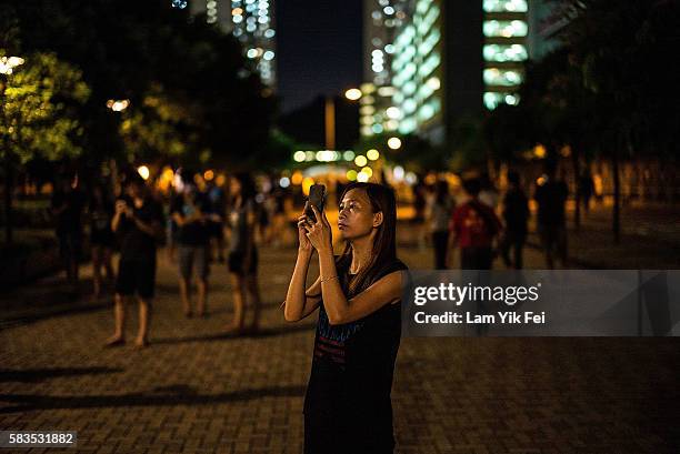 People play the Pokemon Go game at a park at Tin Shui Wai on July 26, 2016 in Hong Kong. "Pokemon Go," which has been a smash-hit across the globe...