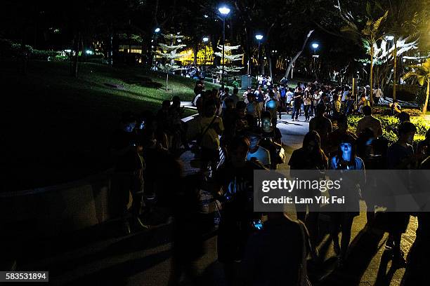 People play the Pokemon Go game at a park at Tuen Mun on July 26, 2016 in Hong Kong. "Pokemon Go," which has been a smash-hit across the globe was...