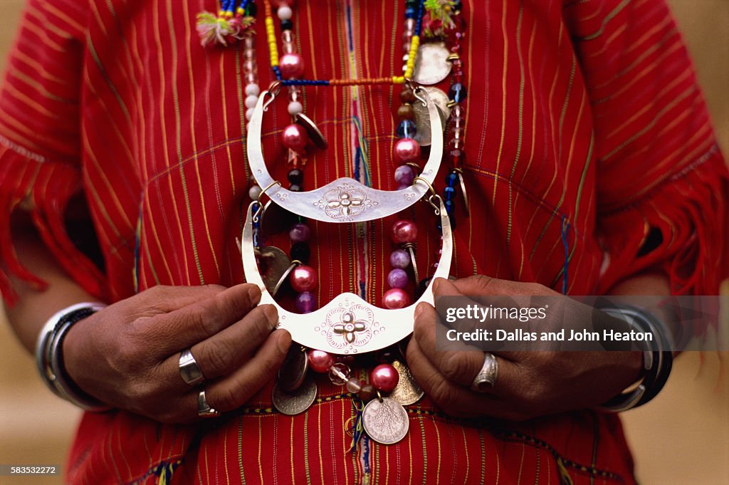 Woman holding tribal jewelry, Chiang Rai, Thailand