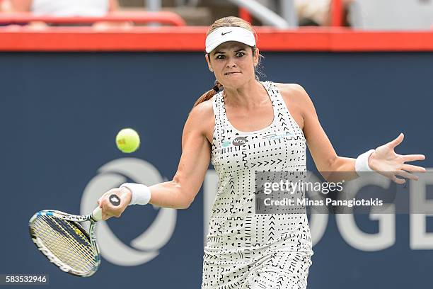 Aleksandra Wozniak of Canada hist a return against Sara Errani of Italy during day two of the Rogers Cup at Uniprix Stadium on July 26, 2016 in...