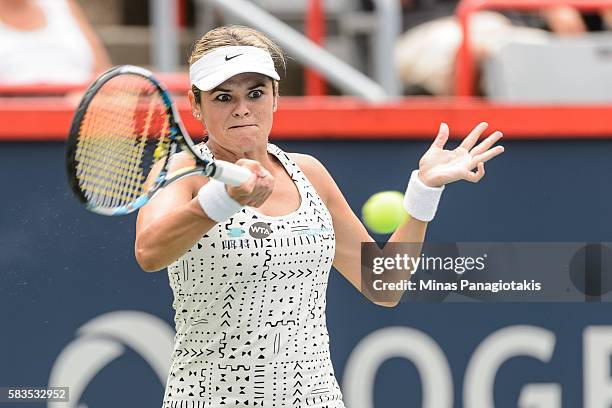 Aleksandra Wozniak of Canada hist a return against Sara Errani of Italy during day two of the Rogers Cup at Uniprix Stadium on July 26, 2016 in...