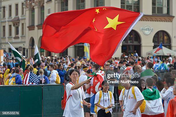 Small group of pilgrims from China in Krakow main square with pilgrims from all around the world ahead of the official opening Mass and the World...