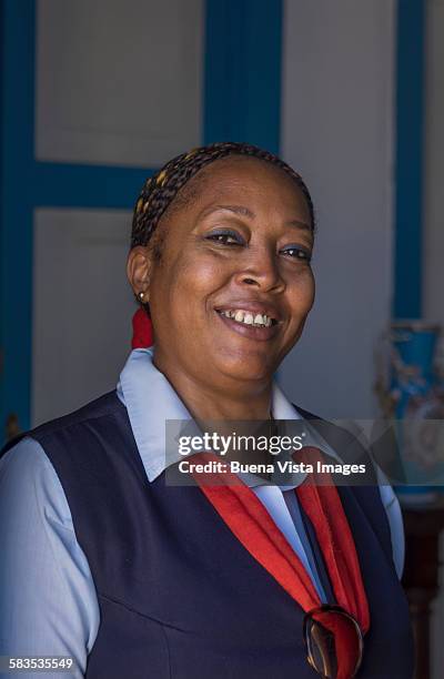 smiling woman in a museum uniform - museum guide stock pictures, royalty-free photos & images