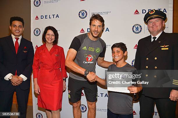 Chelsea Football Club's Carlo Cudicini and Children's Hospital Los Angeles patient Alex Idolor with Delta Air Lines brand ambassadors join Delta Air...