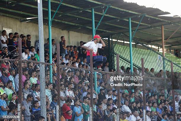 Palestinian spectators watch the first leg of the Palestine Cup final soccer match between Gaza Strip's Khan Younis Youth and Hebron's Al-Ahly at...