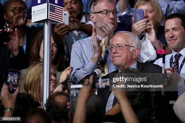 Sen. Bernie Sanders along with the Vermont delegation and his wife Jane O'Meara Sanders cast their votes during roll call on the second day of the...