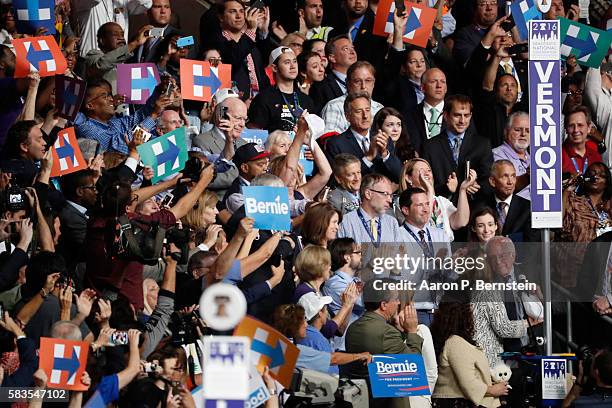 Sen. Bernie Sanders embraces his wife Jane O'Meara Sanders after the Vermont delegation cast their votes during roll call on the second day of the...