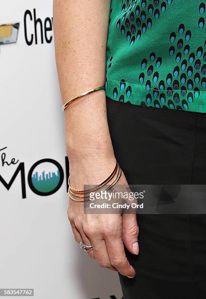 Actress Anna Gunn, gold bracelet detail, attends The Moms Mamarazzi screening of 'Equity' at Crosby Street Theater on July 26, 2016 in New York City.