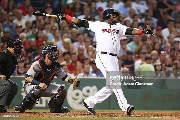 David Ortiz of the Boston Red Sox hits a three-run home run in the third inning during the game against the Detroit Tigers at Fenway Park on July 26,...