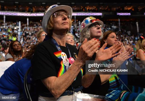 Delegates clap during the second day of the Democratic National Convention at the Wells Fargo Center, July 26, 2016 in Philadelphia, Pennsylvania.