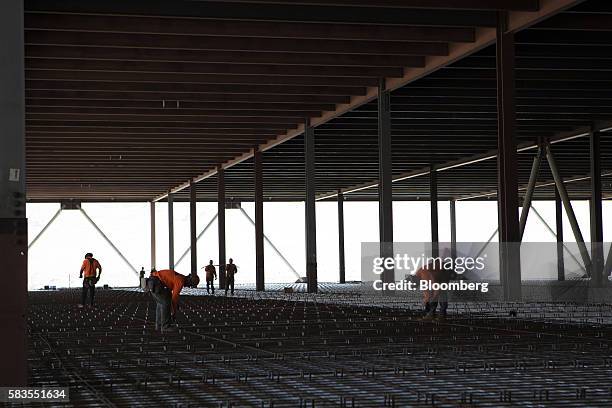 Contractors continue construction on the Tesla Motor Inc. Gigafactory in Sparks, Nevada, U.S., on Tuesday, July 26, 2016. Tesla officially opened its...