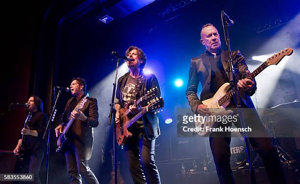 Tommy Williams, Fran Smith, Jr., Eric Bazilian and John Lilley of the American band The Hooters perform live during a concert at the Columbia Theater...