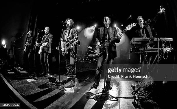 Tommy Williams, John Lilley, Eric Bazilian, Fran Smith, Jr. And Rob Hyman of the American band The Hooters perform live during a concert at the...