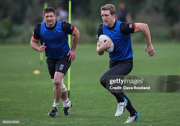 Jacob Lillyman, chases Captain Ryan Hoffman during a New Zealand Warriors NRL training session at Mt Smart Stadium on July 27, 2016 in Auckland, New...