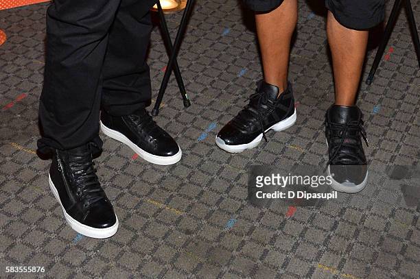 Steven Caple Jr and Nasir "Nas" Jones, shoe detail, attend "The Land" New York premiere at SVA Theater on July 26, 2016 in New York City.