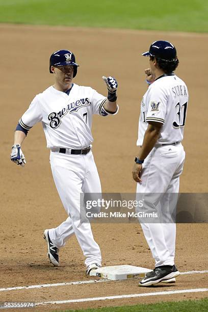 Jake Elmore of the Milwaukee Brewers celebrates after hitting a single during the fourth inning against the Arizona Diamondbacks at Miller Park on...