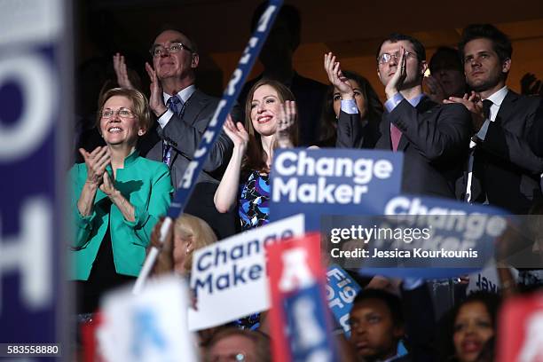 Sen. Elizabeth Warren , Chelsea Clinton and husband Marc Mezvinsky applaud former US President Bill Clinton on the second day of the Democratic...