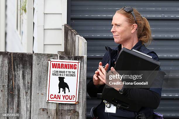 Animal Management Officer Kirsten at a Ranui property on July 27, 2016 in Auckland, New Zealand. The Auckland Council Animal Control undertook a...