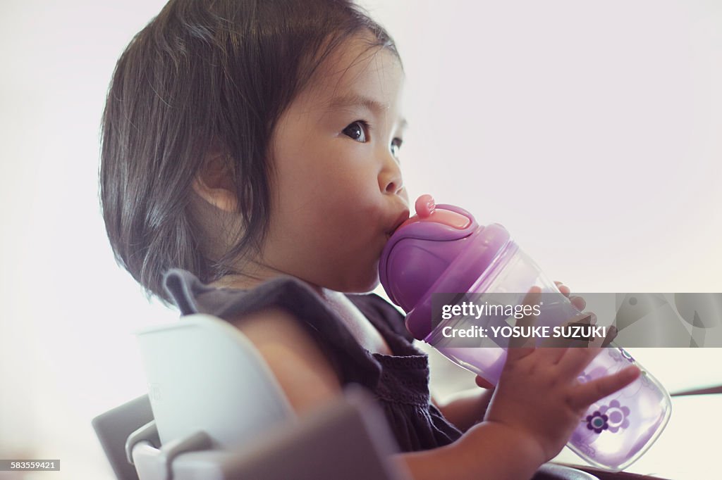 Baby of Asia that are drinking water