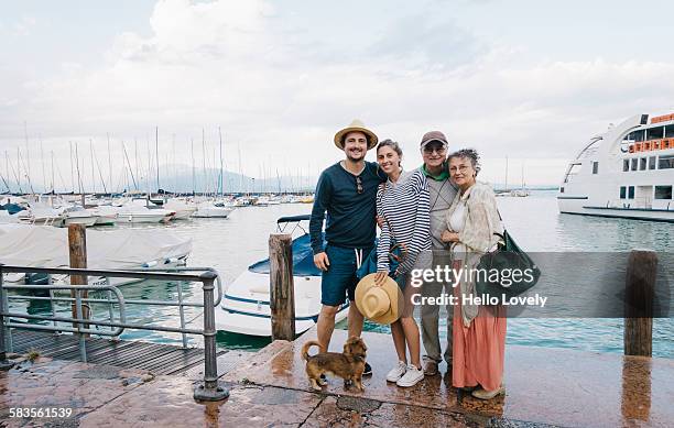 family goes boating - garda stock pictures, royalty-free photos & images