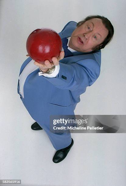 Comedian Raymond Devos Holding Ball