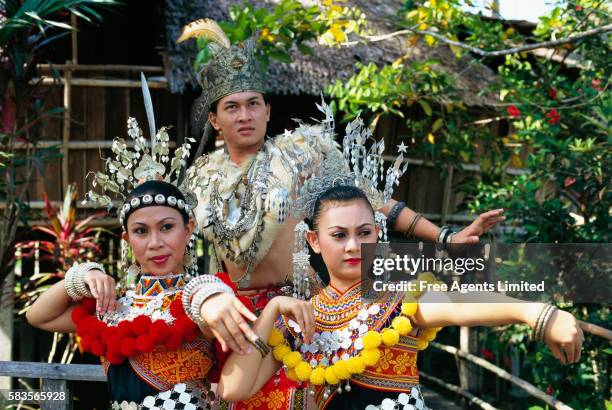 dancers wearing iban costumes - sarawak state stock pictures, royalty-free photos & images