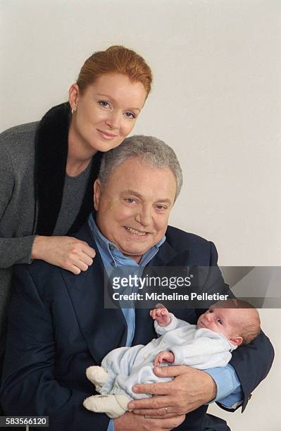 French television personality Jacques Martin and his wife Celine holding their one-month-old infant Clovis. Jacques Martin is a television host,...