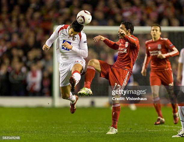 Maxi Rodriguez of Liverpool and Hugo Viana of SC Braga during the UEFA Europa League Round of 16, 2nd Leg match between Liverpool and SC Braga at...