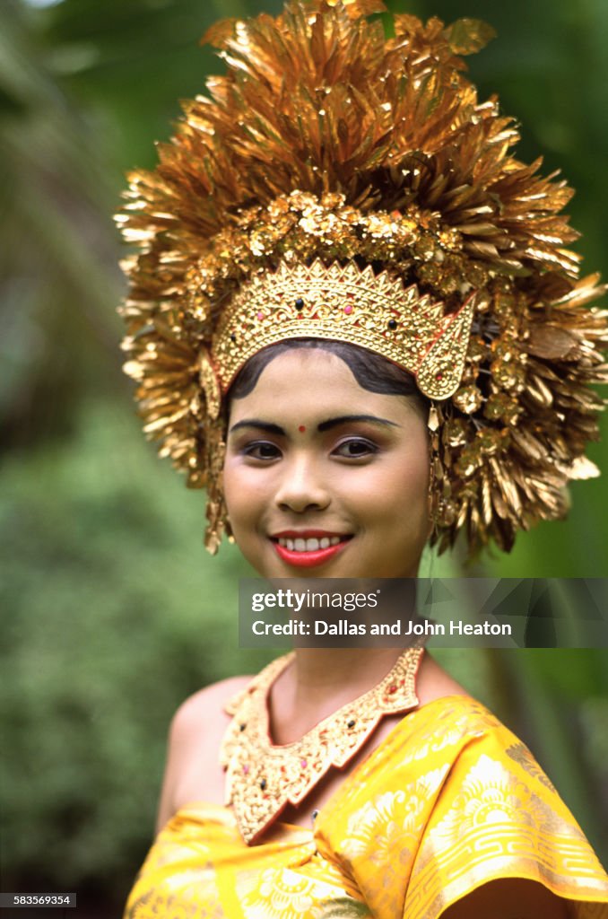 Indonesia, Bali, Young Woman Wearing Balinese Costume