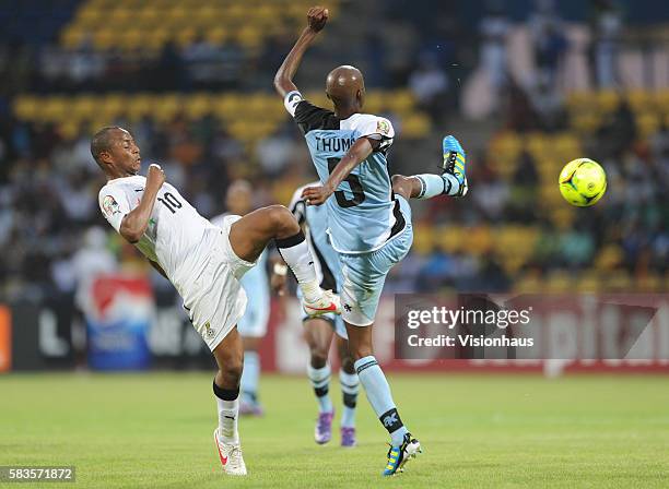 Andre Morgan Rami Ayew of Ghana and Mompati Thuma of Botswana during the 2012 African Cup of Nations Group D match between Ghana and Botswana at...