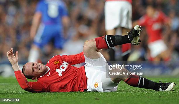 Wayne Rooney of Manchester United lies injured during the UEFA Champions League Quarter Final match between Chelsea and Manchester United at Stamford...