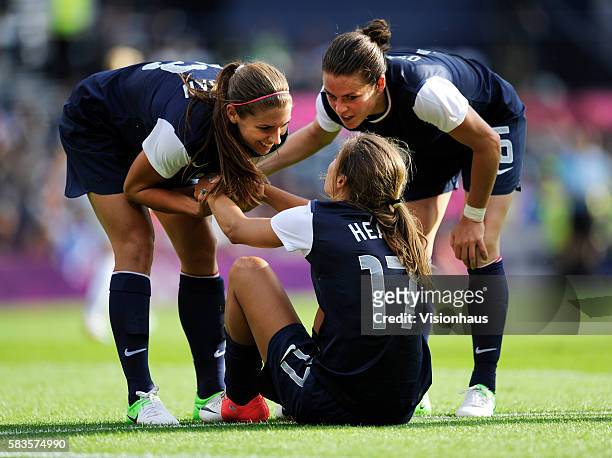 Goalscorer Alex Morgan and Kelley O'Hara thank provider Tobin Heath during the womens Group G football match between USA and France as part of the...