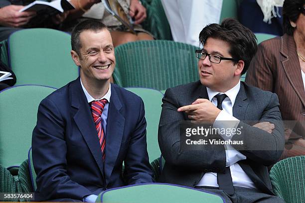 Comedians Paul Tonkinson and Michael McIntyre share a joke during the Ladies Singles Final match between Serena Williams and Agnieszka Radwanska on...