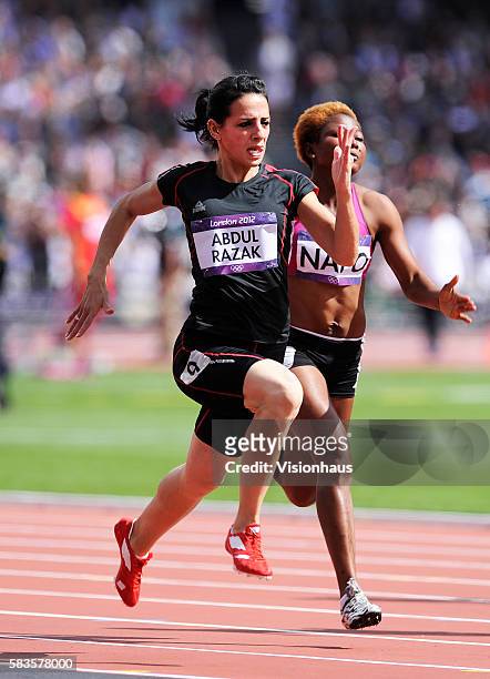 Dana Abdul Razak of Iraq takes part in the Womens 100m Preliminary Round as part of the 2012 London Olympic Summer Games at the Olympic Stadium,...