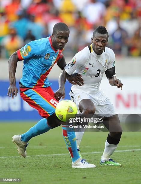 Asamoah Gyan of Ghana and Larrys Mabiala Destin of DR Congo during the 2013 African Cup of Nations Group B match between Ghana and DR Congo at the...