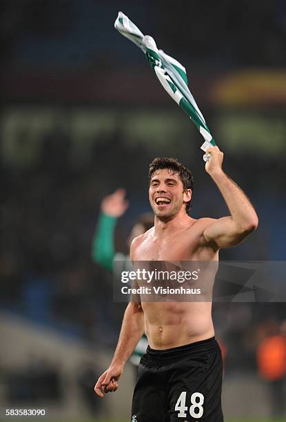 Emiliano Insua of Sporting Lisbon celebrates victory after the UEFA Europa League Round of 16 match between Manchester City and Sporting Lisbon at...