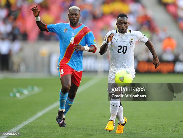 Kwadwo Asamoah of Ghana and Patou Mulota Kabangu of DR Congo during the 2013 African Cup of Nations Group B match between Ghana and DR Congo at the...