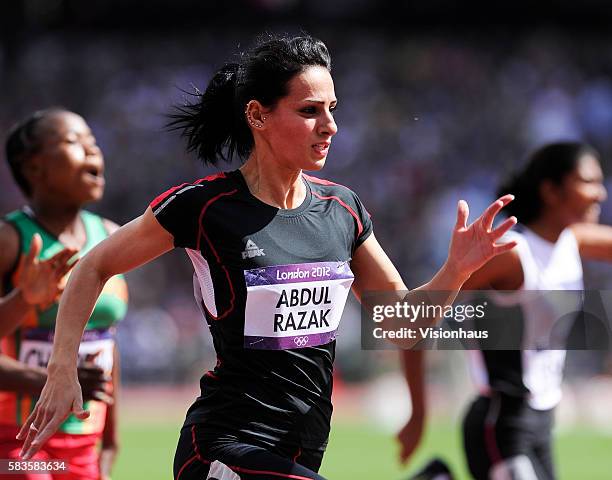 Dana Abdul Razak of Iraq takes part in the Womens 100m Preliminary Round as part of the 2012 London Olympic Summer Games at the Olympic Stadium,...