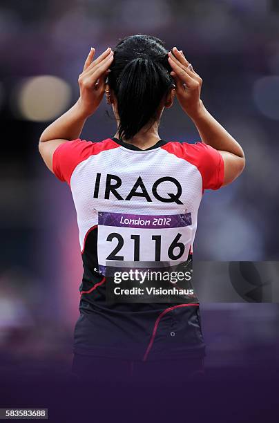 Dana Abdul Razak of Iraq prepares to run in the Womens 100m as part of the 2012 London Olympic Summer Games at the Olympic Stadium, Olympic Park,...