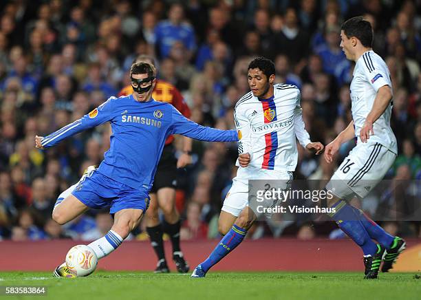 Fernando Torres of Chelsea and Mohamed Elneny and Fabien Schar of FC Basle during the Europa League Semi-Final 2nd Leg match between Chelsea and FC...