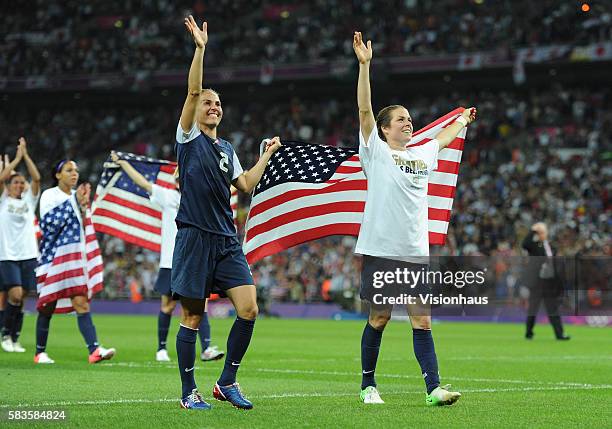 Heather Mitts and Kelley O'Hara celebrate as USA win the USA vs. Japan Final match in the Women's Soccer Competition as part of the 2012 London...