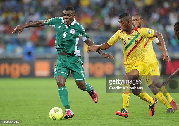 Emmanuel Emenike of Nigeria and Molla Wague of Nigeria during the 2013 African Cup of Nations Semi-final match between Mali and Nigeria at the Moses...