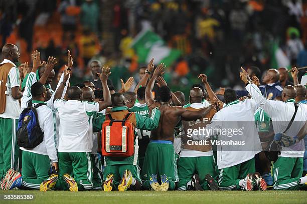 Nigeria players and staff pray and celebrate after winning the 2013 African Cup of Nations Final match between Nigeria and Burkina Faso at the...
