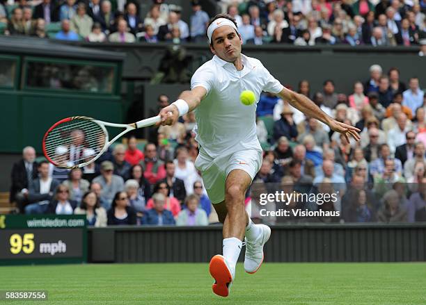 Roger Federer of Switzerland during his first round match against Victor Hanescu of Romania of on Day One of the 2013 Wimbledon Tennis Championships...
