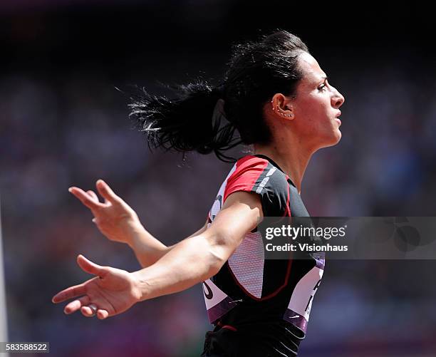 Dana Abdul Razak of Iraq takes part in the Womens 100m Preliminary Round as part of the 2012 London Olympic Summer Games at the Olympic Stadium,...