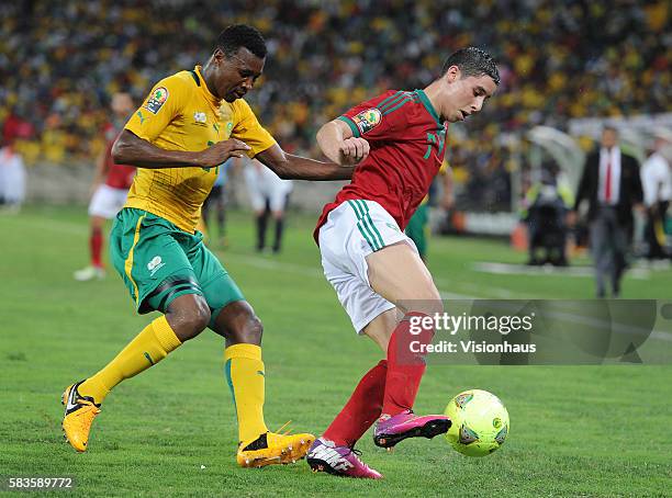 Abdelazizi Barrada of Morocco and Siyabonga Sangweni of South Africa during the 2013 African Cup of Nations Group A match between South Africa and...