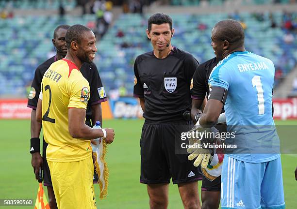 Mali Captain Seydou Keita shares a joke with Nigeria Captain Vincent Enyeama during the 2013 African Cup of Nations Semi-final match between Mali and...